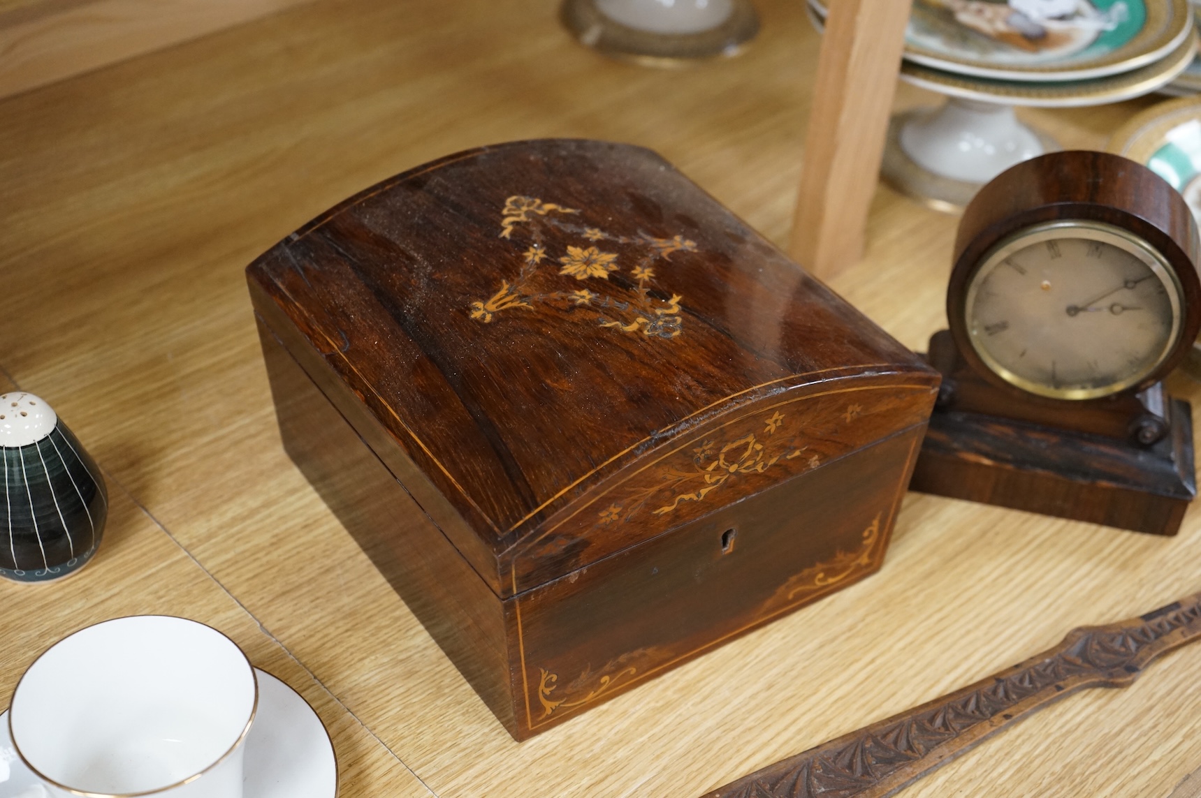 A 19th century rosewood and inlaid silk lined box, a small VAP timepiece and a carved page turner, largest 22cm wide